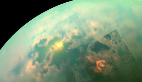 In this near-infrared mosaic, the sun shines off of the seas on Saturn's moon, Titan.